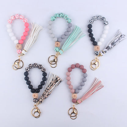 Beech Wood with Eyes Octagonal Tassels Silicone Bead Wristlet Keychain