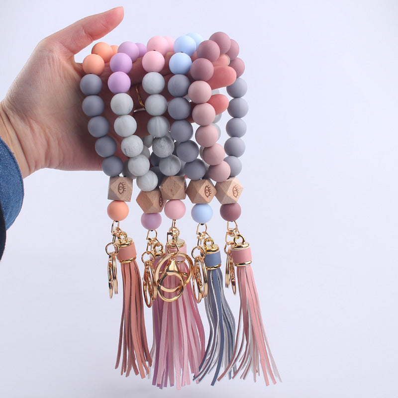 Beech Wood with Eyes Octagonal Tassels Silicone Bead Wristlet Keychain 4